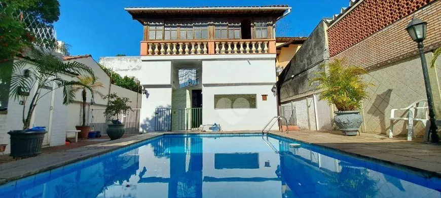 Foto 1 de Casa com 4 Quartos à venda, 385m² em Grajaú, Rio de Janeiro