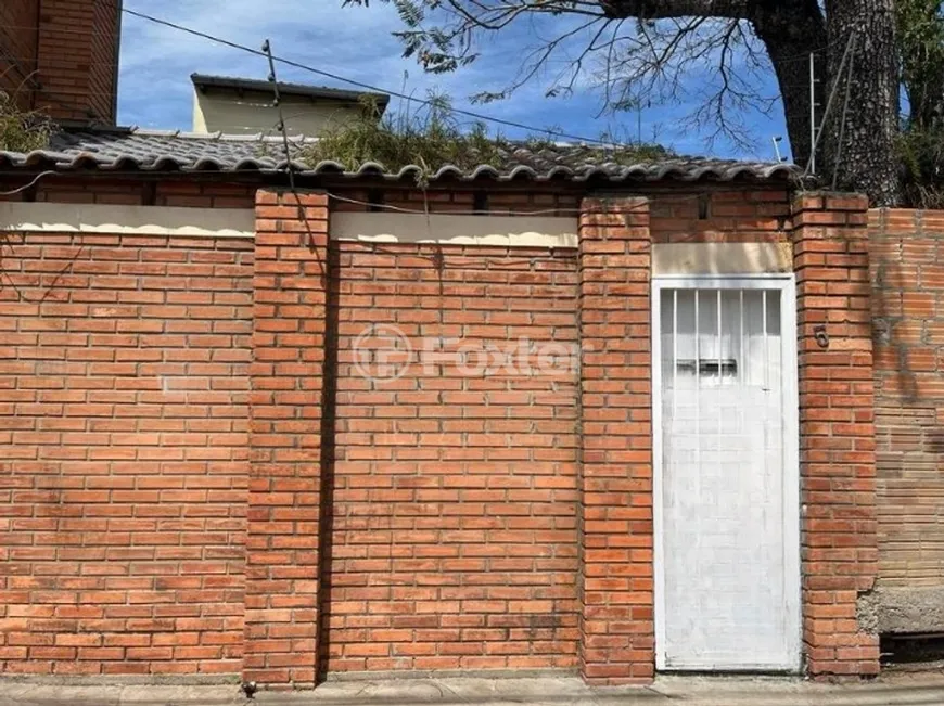 Foto 1 de Casa com 4 Quartos à venda, 250m² em Santa Maria Goretti, Porto Alegre