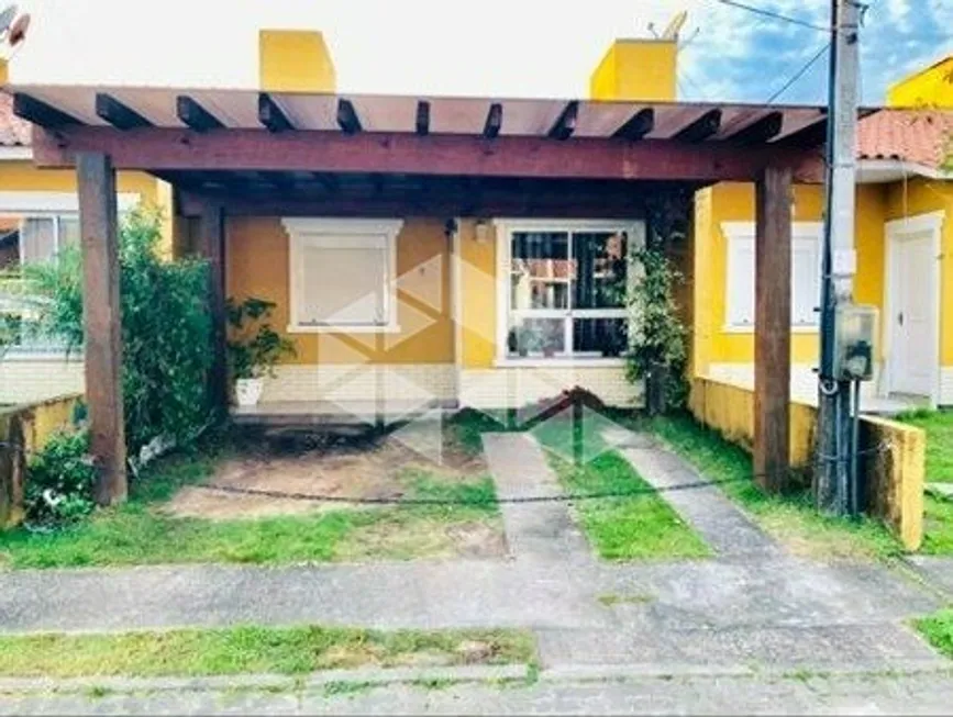 Foto 1 de Casa de Condomínio com 2 Quartos à venda, 52m² em Hípica, Porto Alegre