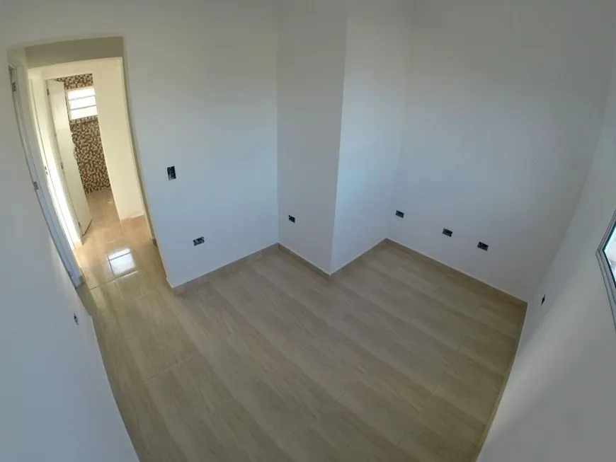 Foto 1 de Casa com 2 Quartos à venda, 57m² em Jardim Guaramar, Praia Grande