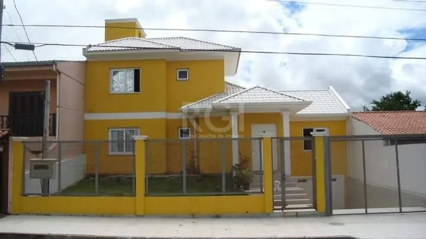 Foto 1 de Casa com 3 Quartos à venda, 249m² em Vila Nova, Porto Alegre