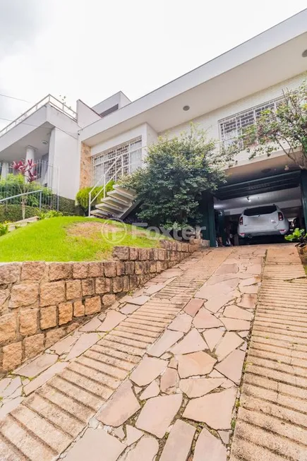 Foto 1 de Casa com 3 Quartos à venda, 227m² em Três Figueiras, Porto Alegre