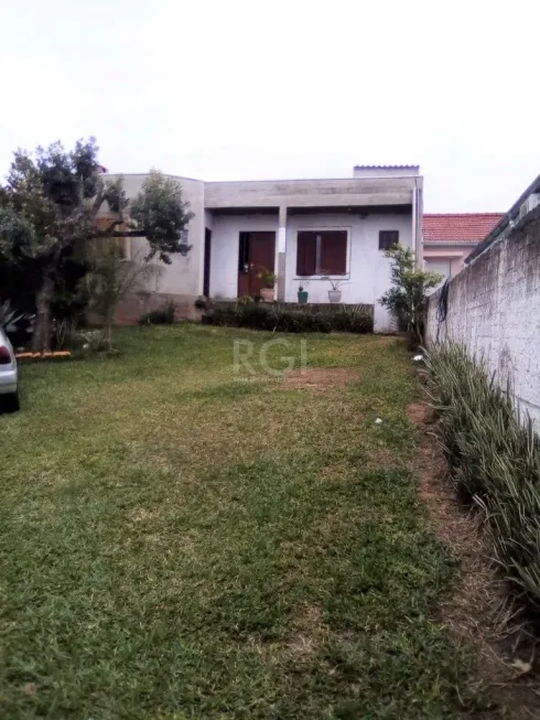 Foto 1 de Casa com 4 Quartos à venda, 129m² em Santa Fé, Porto Alegre