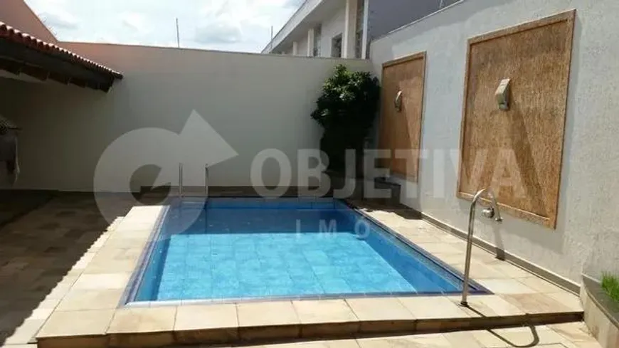 Foto 1 de Casa com 5 Quartos à venda, 410m² em Segismundo Pereira, Uberlândia