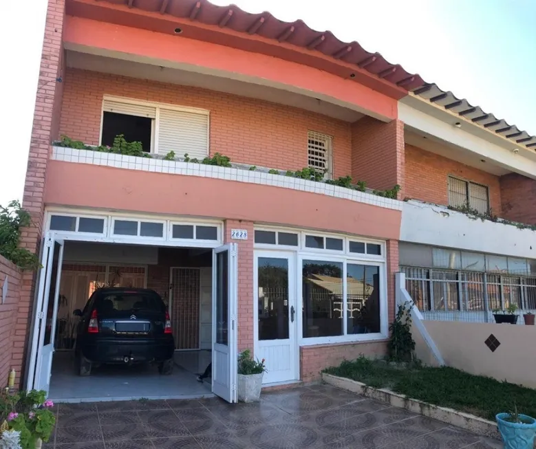 Foto 1 de Casa com 4 Quartos à venda, 100m² em Centro, Tramandaí