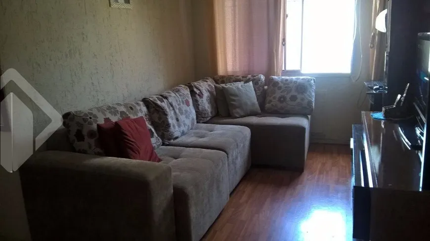 Foto 1 de Apartamento com 3 Quartos à venda, 67m² em Vila Nova, Porto Alegre