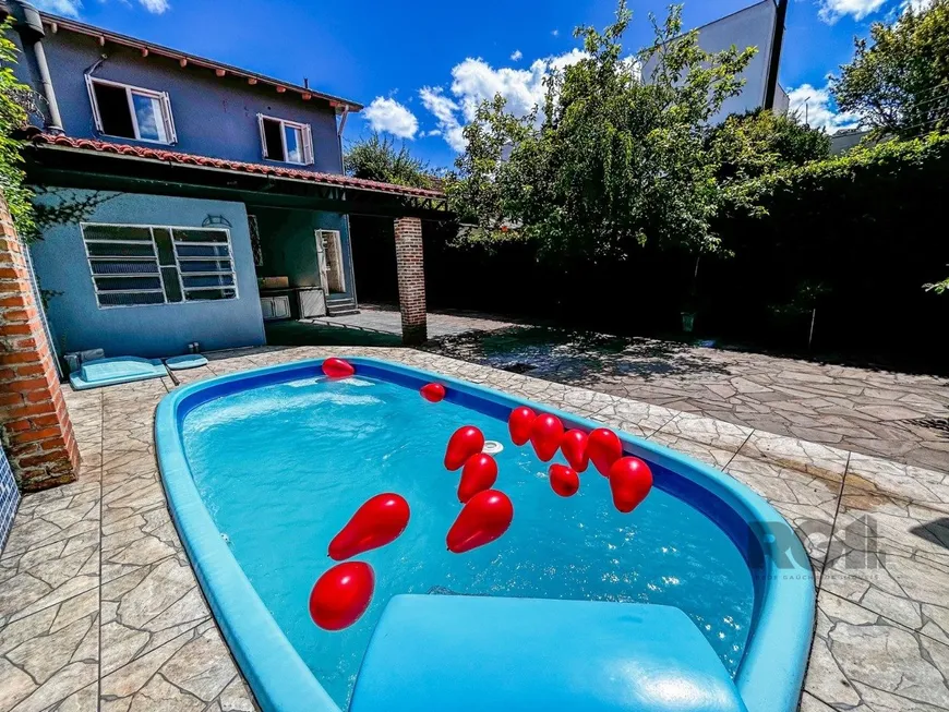 Foto 1 de Casa com 4 Quartos à venda, 243m² em Cavalhada, Porto Alegre