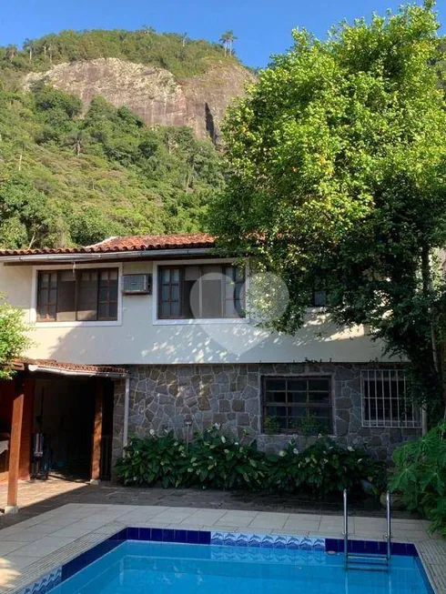 Foto 1 de Casa de Condomínio com 4 Quartos à venda, 430m² em Barra da Tijuca, Rio de Janeiro