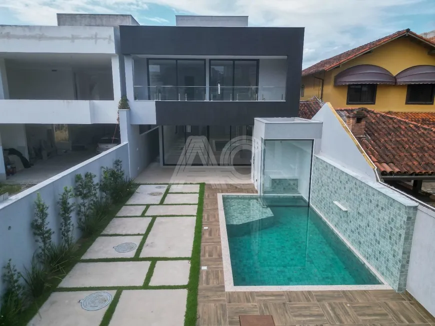 Foto 1 de Casa de Condomínio com 4 Quartos à venda, 350m² em Barra da Tijuca, Rio de Janeiro