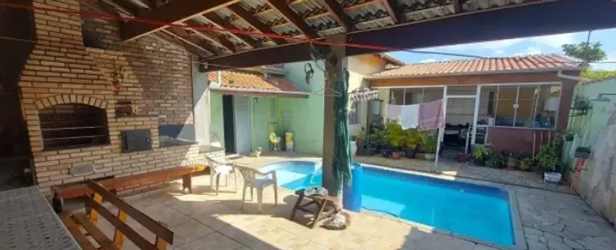 Foto 1 de Casa com 4 Quartos à venda, 300m² em Balneário dos Golfinhos , Caraguatatuba