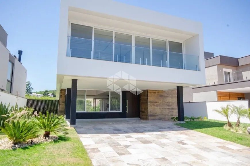Foto 1 de Casa de Condomínio com 4 Quartos à venda, 440m² em Vila Nova, Porto Alegre