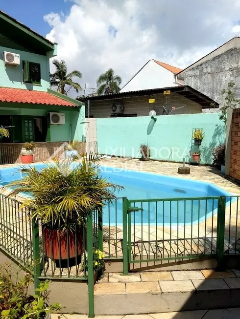 Foto 1 de Casa com 4 Quartos à venda, 297m² em Guarujá, Porto Alegre