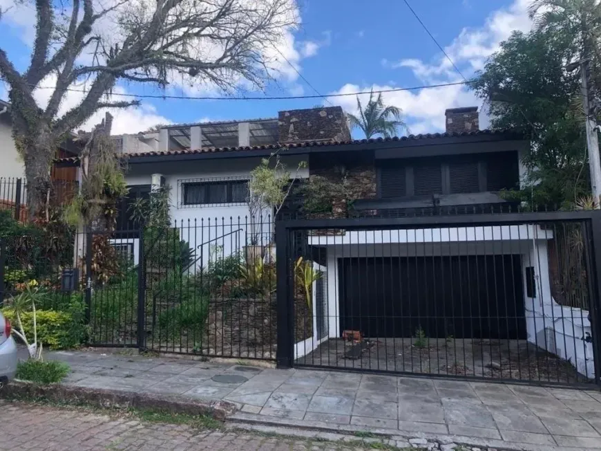 Foto 1 de Casa com 4 Quartos à venda, 309m² em Três Figueiras, Porto Alegre