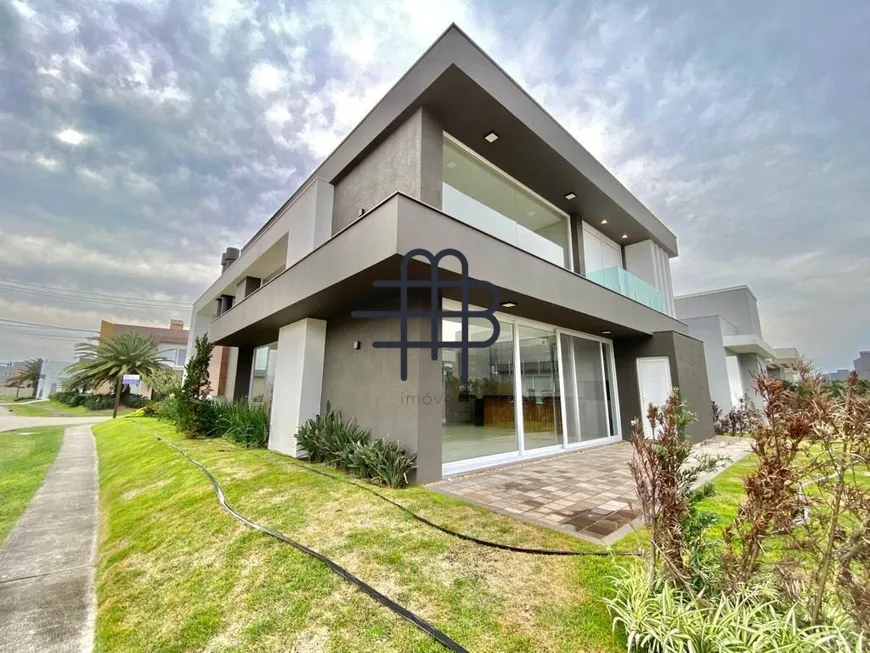 Foto 1 de Casa de Condomínio com 4 Quartos à venda, 300m² em Zona Nova, Capão da Canoa