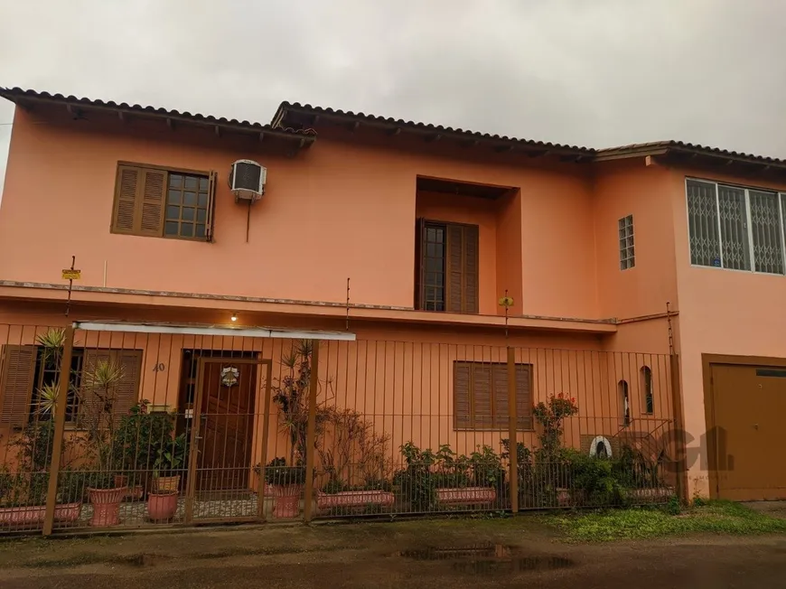 Foto 1 de Casa com 4 Quartos à venda, 299m² em Restinga, Porto Alegre