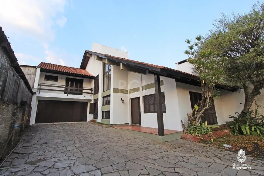 Foto 1 de Casa com 4 Quartos à venda, 321m² em Cavalhada, Porto Alegre
