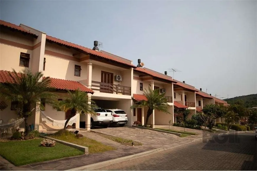 Foto 1 de Casa de Condomínio com 3 Quartos à venda, 244m² em Cavalhada, Porto Alegre