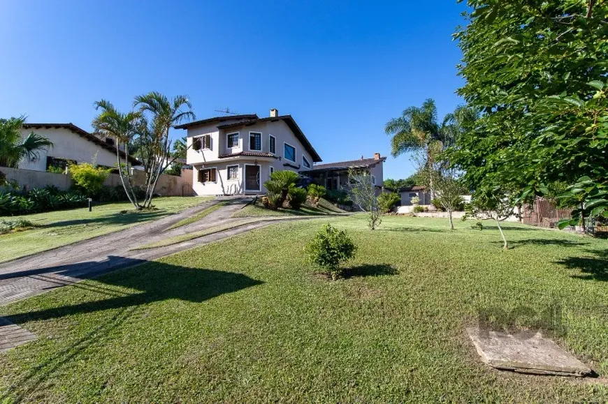 Foto 1 de Casa com 3 Quartos à venda, 248m² em Vila Nova, Porto Alegre