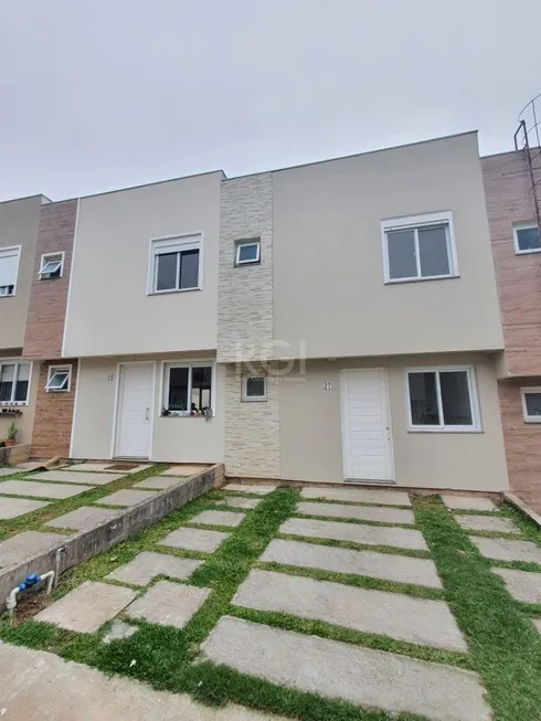 Foto 1 de Casa de Condomínio com 2 Quartos à venda, 63m² em Vila Nova, Porto Alegre