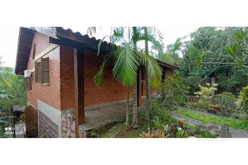 Foto 1 de Casa com 2 Quartos à venda, 210m² em Vila Nova, Porto Alegre