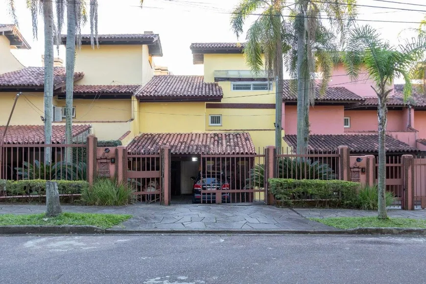 Foto 1 de Casa de Condomínio com 4 Quartos à venda, 381m² em Santa Tereza, Porto Alegre