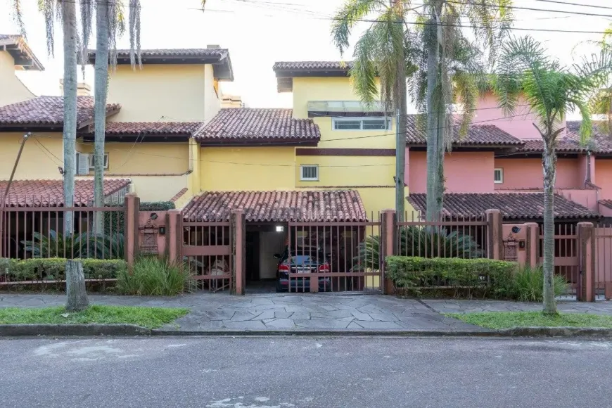 Foto 1 de Casa de Condomínio com 4 Quartos à venda, 382m² em Santa Tereza, Porto Alegre