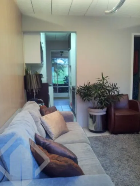 Foto 1 de Casa de Condomínio com 2 Quartos à venda, 55m² em Vila Nova, Porto Alegre