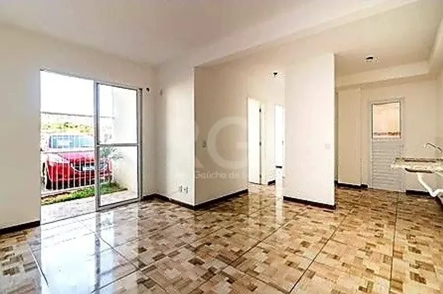 Foto 1 de Apartamento com 2 Quartos à venda, 49m² em Vila Nova, Porto Alegre