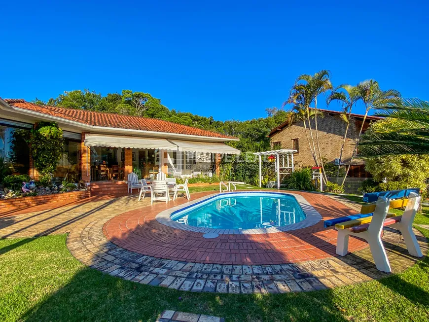 Foto 1 de Casa de Condomínio com 3 Quartos à venda, 384m² em Cacupé, Florianópolis