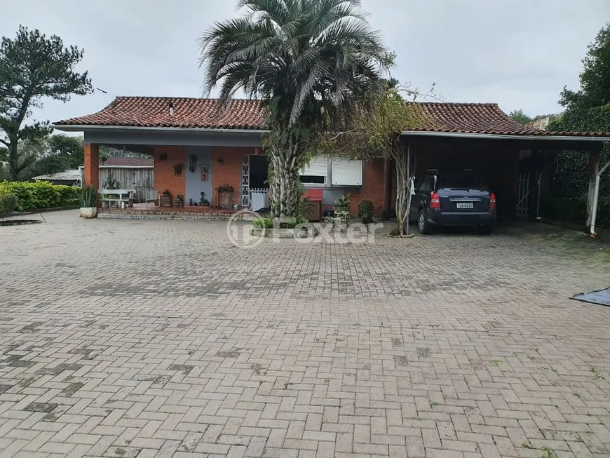 Foto 1 de Casa com 3 Quartos à venda, 141m² em Vila Nova, Porto Alegre