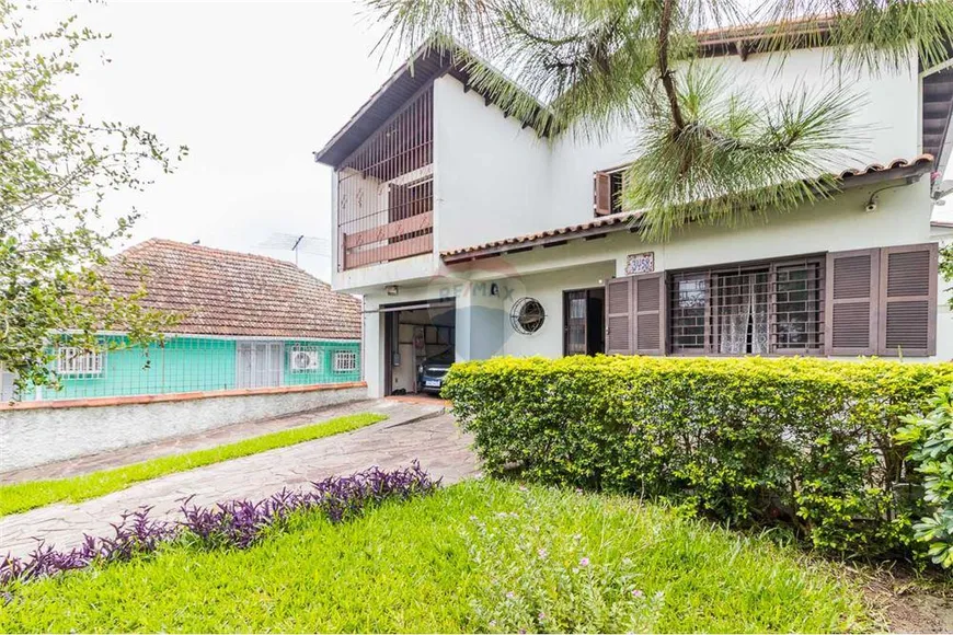 Foto 1 de Casa com 3 Quartos à venda, 313m² em Cavalhada, Porto Alegre