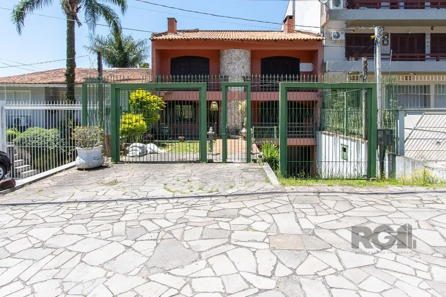 Foto 1 de Casa com 6 Quartos à venda, 572m² em Cavalhada, Porto Alegre