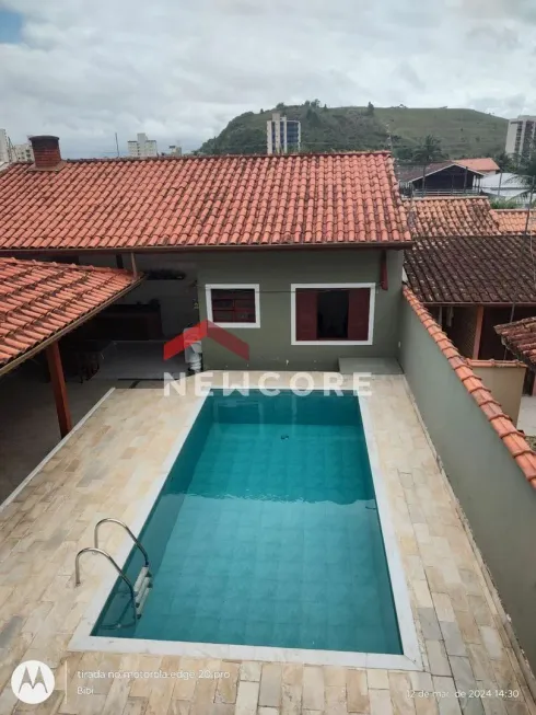 Foto 1 de Casa com 4 Quartos à venda, 250m² em Martim de Sa, Caraguatatuba