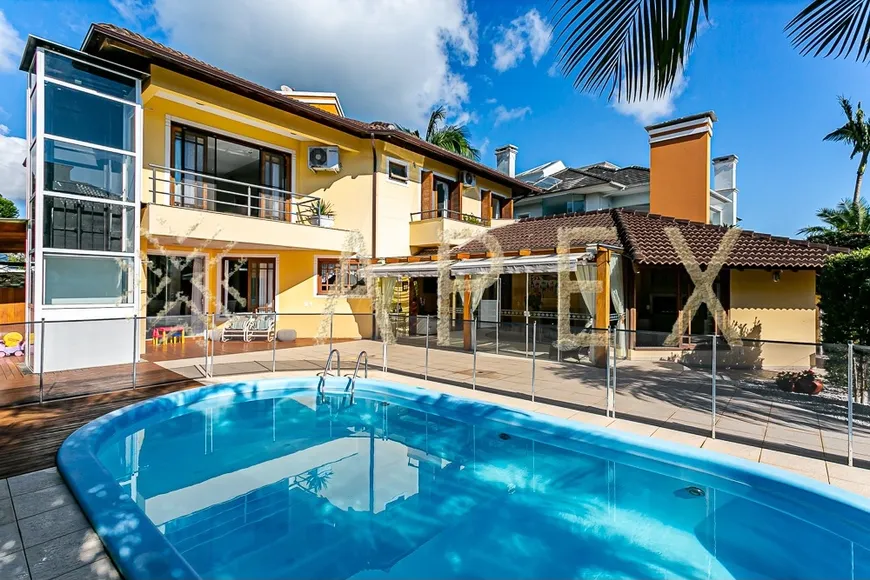 Foto 1 de Casa com 4 Quartos para venda ou aluguel, 400m² em Jurerê Internacional, Florianópolis