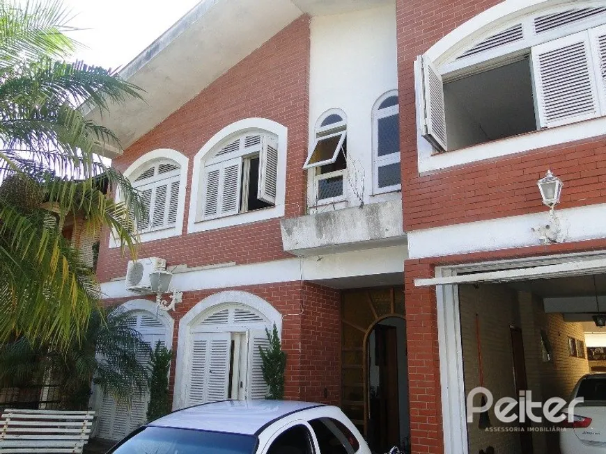 Foto 1 de Casa com 4 Quartos à venda, 242m² em Tristeza, Porto Alegre