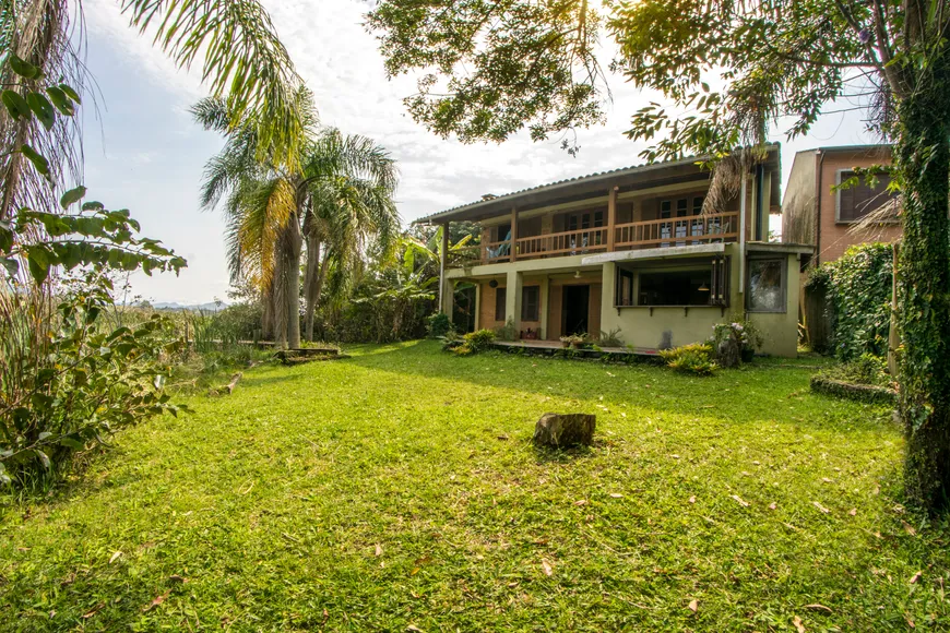 Foto 1 de Casa de Condomínio com 4 Quartos à venda, 200m² em Barra de Ibiraquera, Imbituba