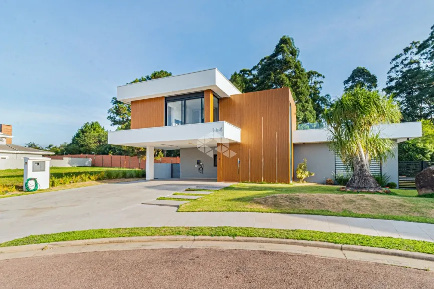 Foto 1 de Casa de Condomínio com 5 Quartos à venda, 321m² em Vila Nova, Porto Alegre