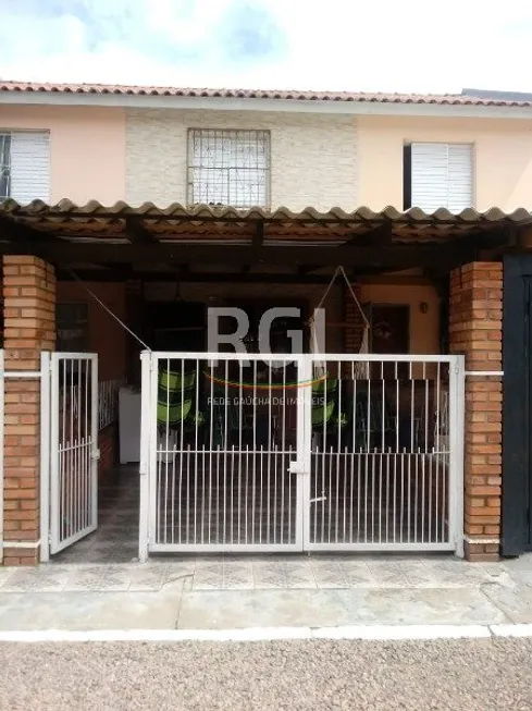 Foto 1 de Casa de Condomínio com 2 Quartos à venda, 50m² em Vila Nova, Porto Alegre