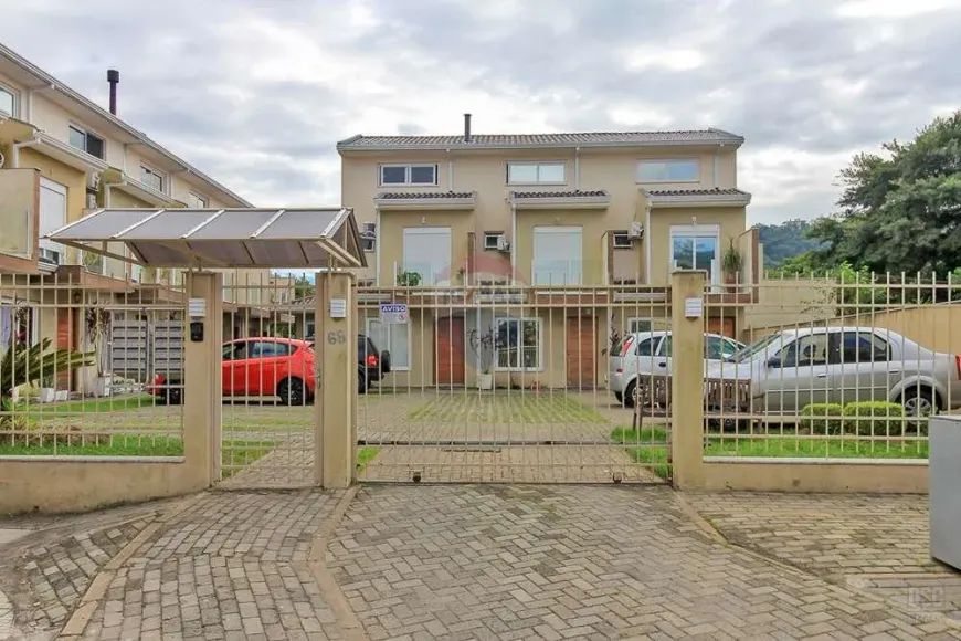 Foto 1 de Casa de Condomínio com 2 Quartos à venda, 93m² em Vila Nova, Porto Alegre