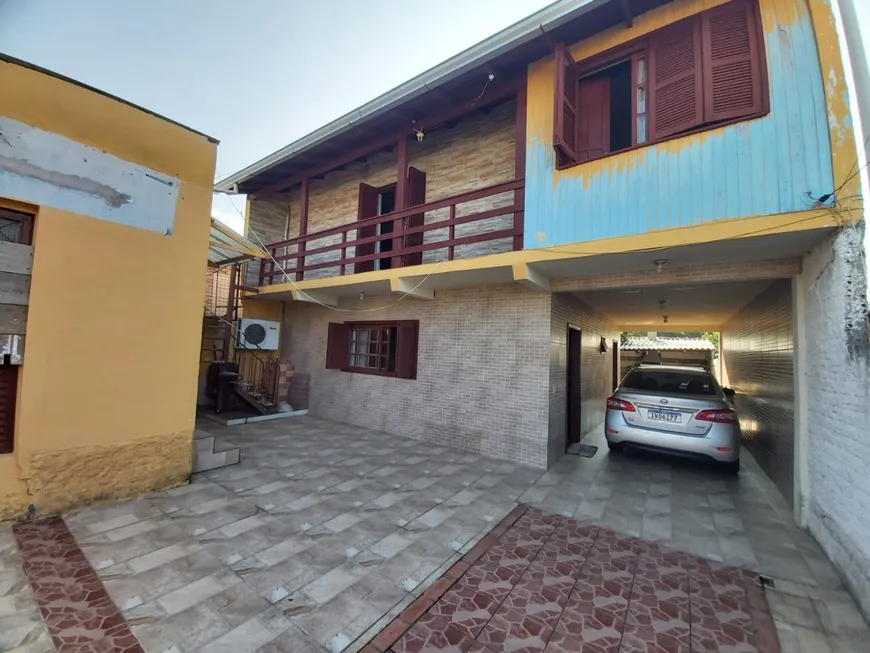Foto 1 de Casa com 3 Quartos à venda, 101m² em Vila Nova, Porto Alegre
