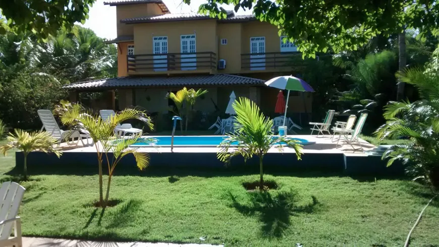 Foto 1 de Casa de Condomínio com 6 Quartos à venda, 600m² em Itacimirim, Camaçari