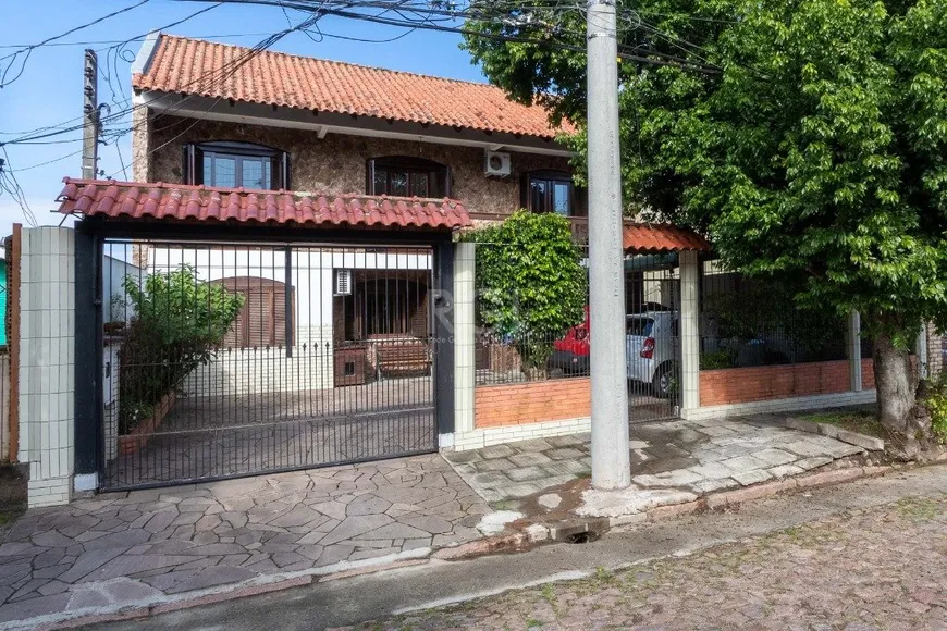 Foto 1 de Casa com 5 Quartos à venda, 302m² em Cavalhada, Porto Alegre