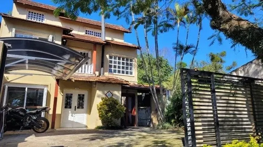 Foto 1 de Casa com 4 Quartos à venda, 244m² em Tristeza, Porto Alegre
