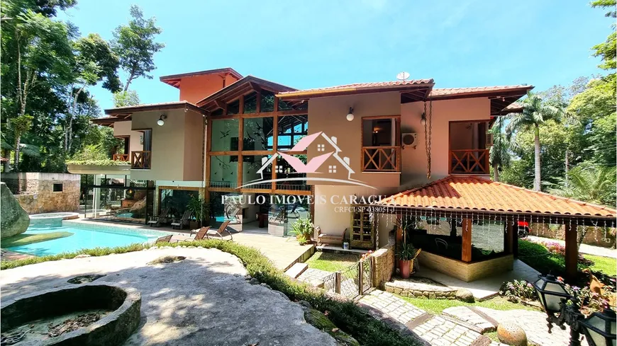 Foto 1 de Casa de Condomínio com 6 Quartos à venda, 700m² em Massaguaçu, Caraguatatuba