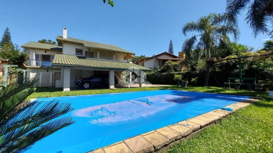 Foto 1 de Casa de Condomínio com 3 Quartos à venda, 400m² em Cavalhada, Porto Alegre