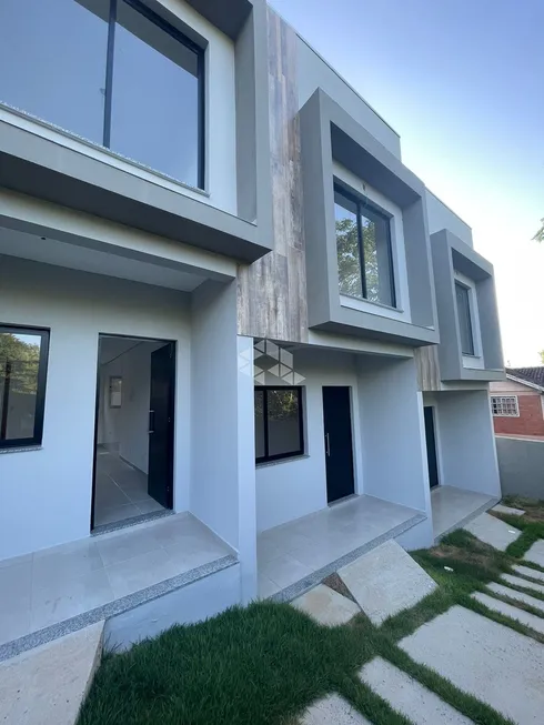 Foto 1 de Casa com 2 Quartos à venda, 61m² em Tarumã, Viamão