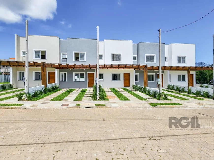 Foto 1 de Casa de Condomínio com 3 Quartos à venda, 94m² em Campo Novo, Porto Alegre