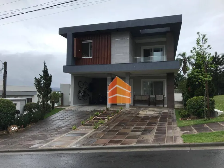 Foto 1 de Casa de Condomínio com 4 Quartos à venda, 325m² em Alphaville, Gravataí