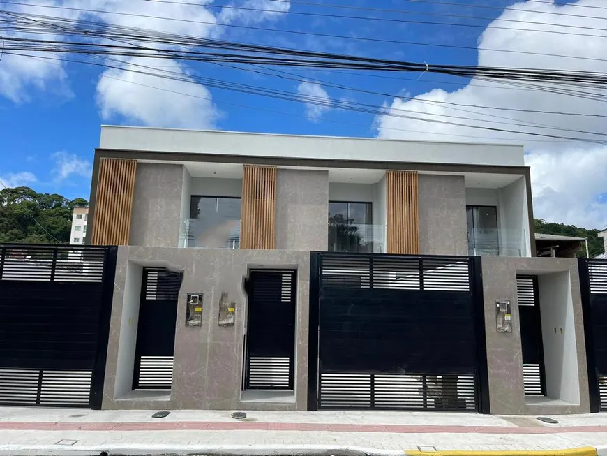Foto 1 de Sobrado com 3 Quartos à venda, 116m² em Tabuleiro Monte Alegre, Camboriú