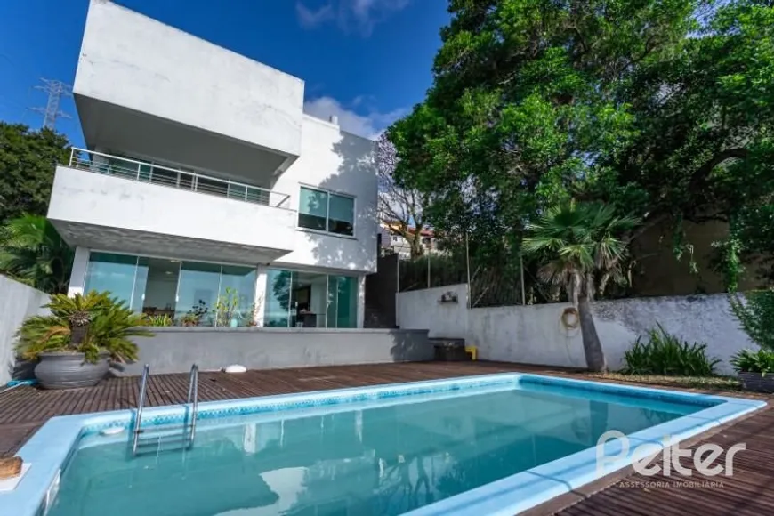 Foto 1 de Casa com 4 Quartos à venda, 421m² em Nonoai, Porto Alegre